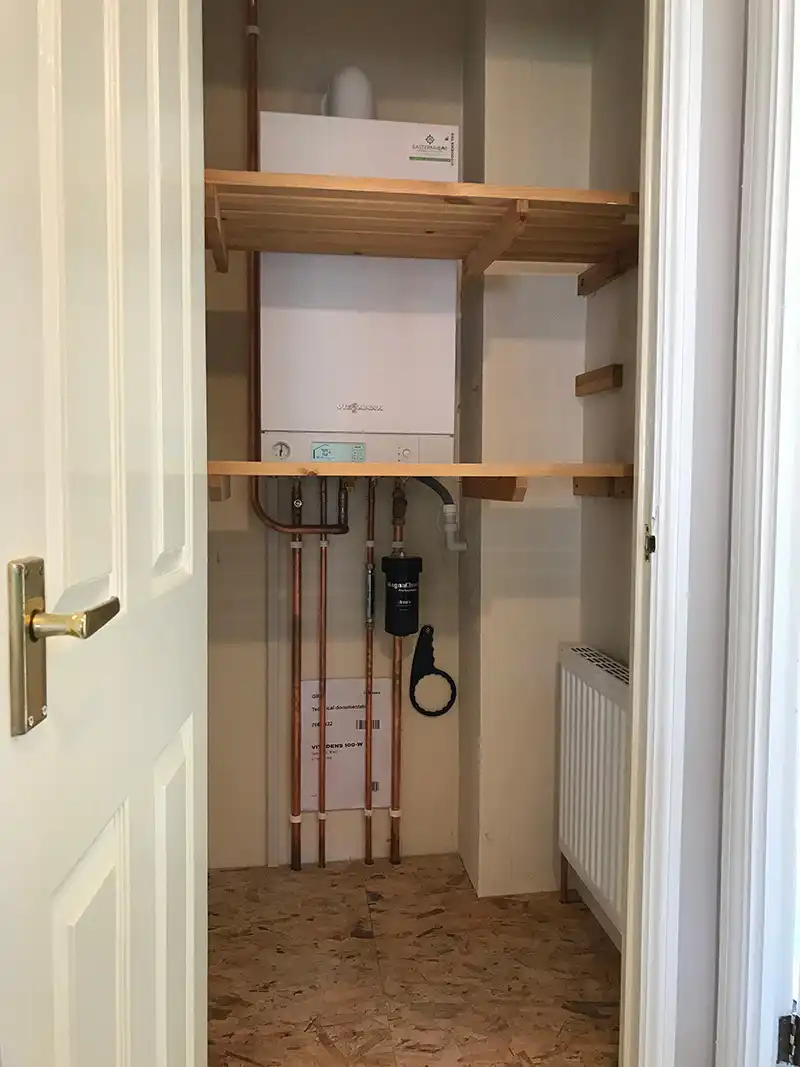 Combination boiler installation. Keeping as an airing cupboard with the use of a small radiator